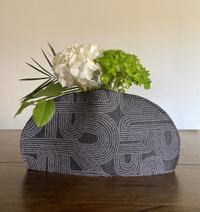 Felt vase sleeve. Handmade, eco-friendly, and sustainable decor. Upcycle recycling through a flexible designed vase cover. 